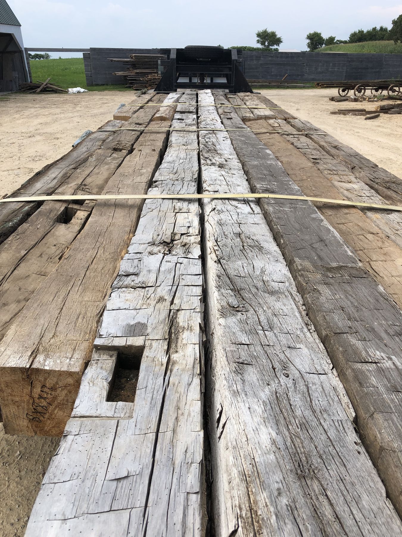 Hand-hewn face — axe facets across the grain