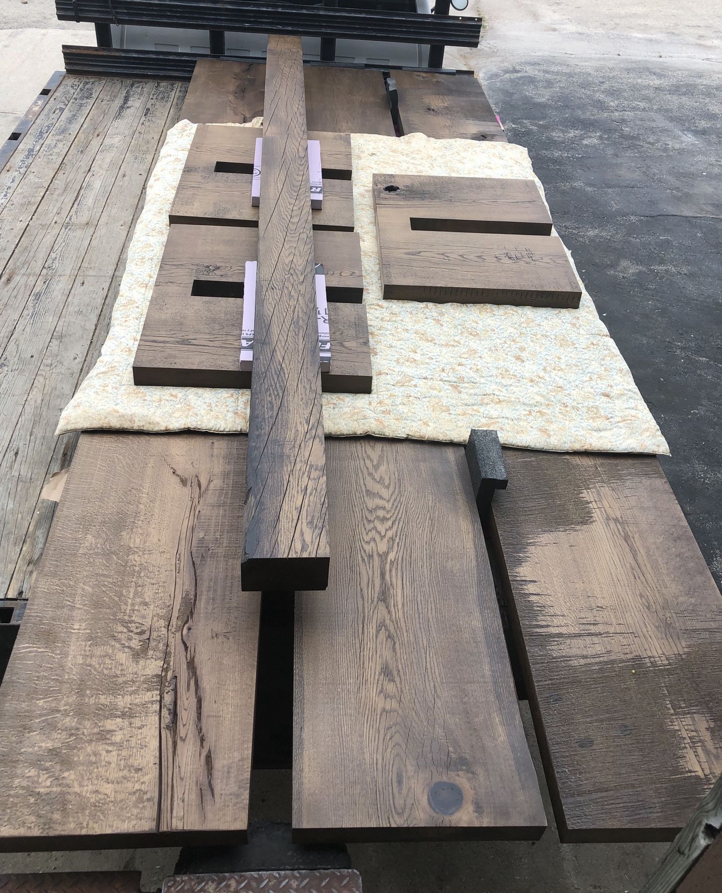 Table components laid out on the shop floor before assembly