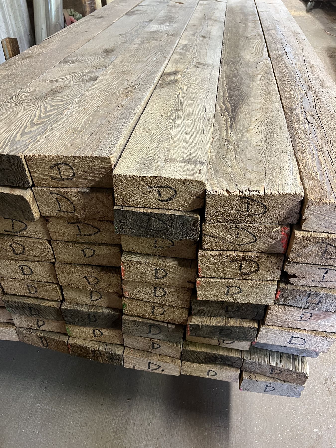 Rough sawn dimensional lumber, stacked and banded