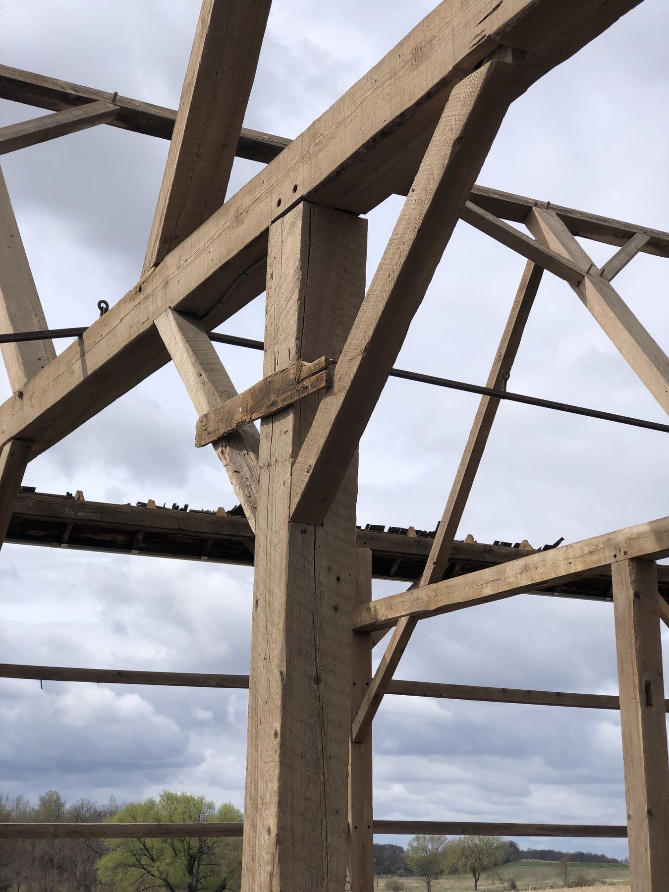 A Wisconsin barn frame standing open during takedown
